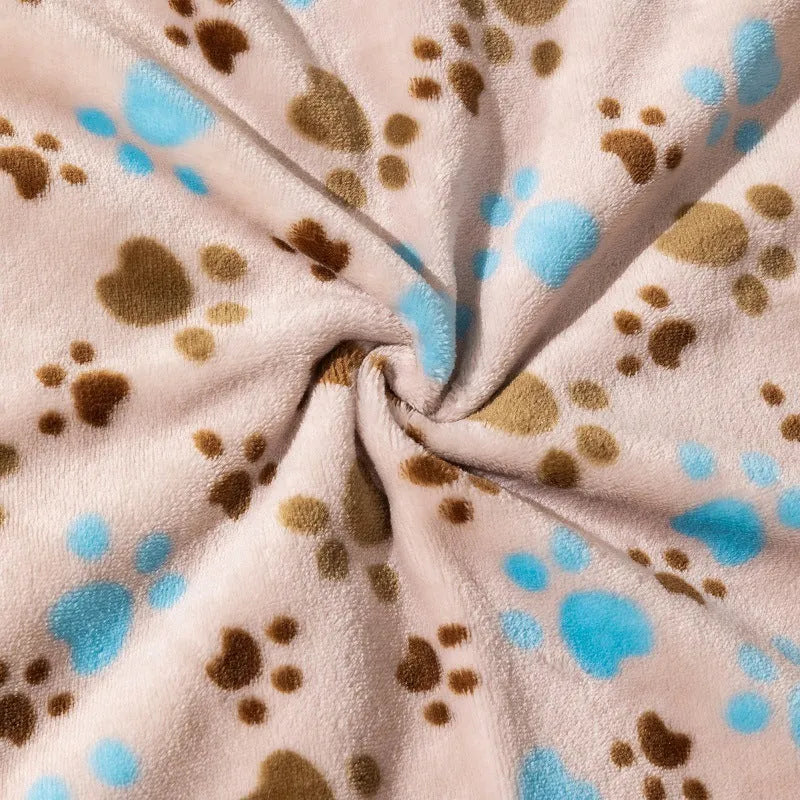 Blue cartoon dog paw pattern pet blanket showing double-sided thickened flannel texture