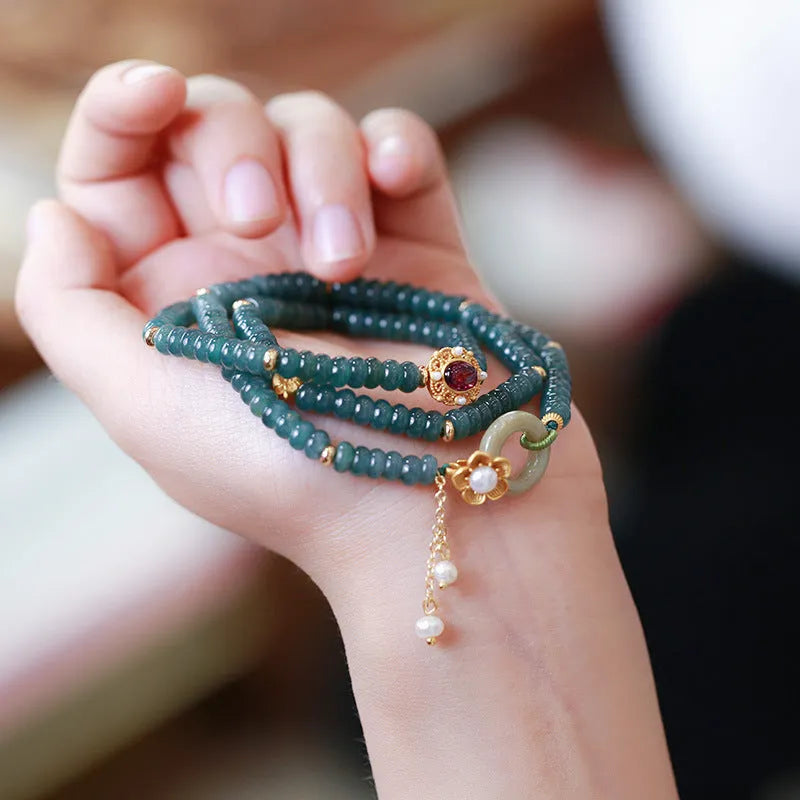 Blue water jade abacus bead and tourmaline bracelet on three sterling silver rings for women.