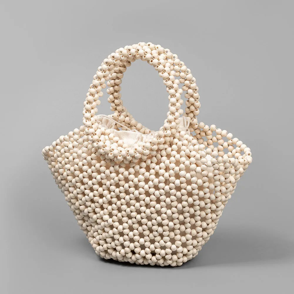 Hand-woven wooden bead beach handbag dumpling shape turmeric colour 13x7x18cm