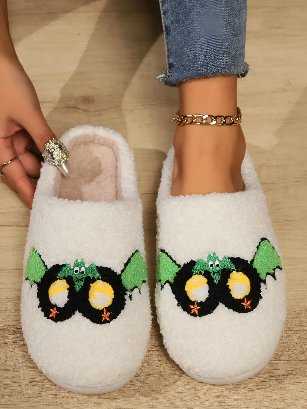 Women's indoor plush thermal cotton slippers with linen upper, non-slip sole, colour Mask Black, on a light indoor floor