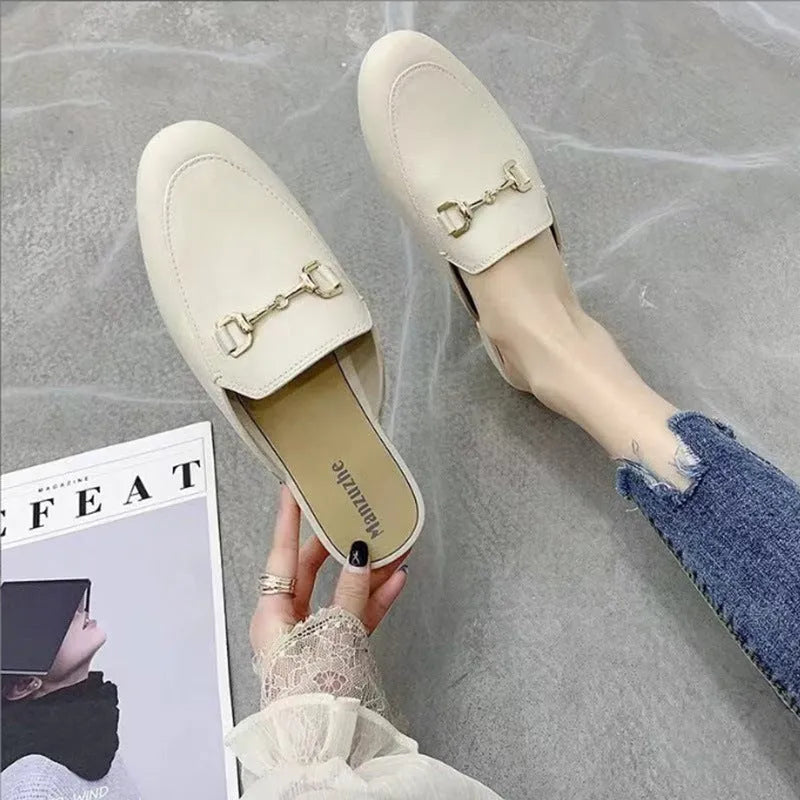 Women's PVC closed toe half slippers with buckle fastening in milky white
