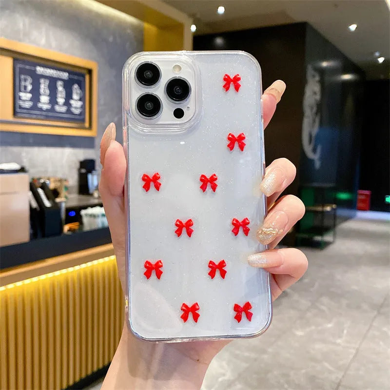 Epoxy glitter bow silicone iPhone case in white, black, purple, or red for iPhone 11 to 16 Pro Max.