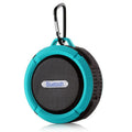 Waterproof Bluetooth speaker with suction cup mounting in bathroom setting