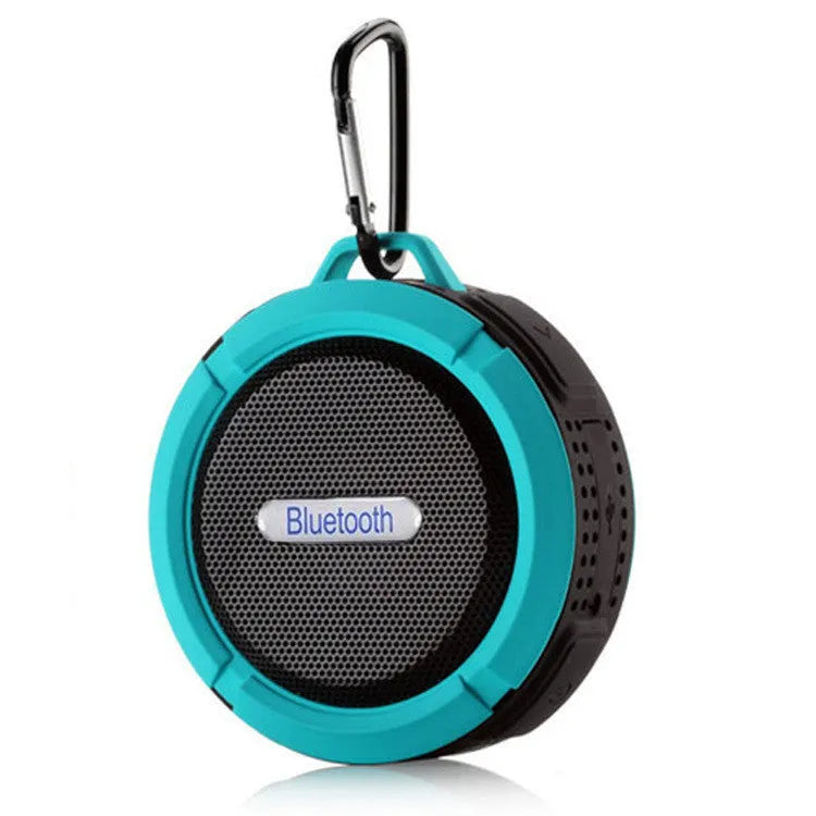 Waterproof Bluetooth speaker with suction cup mounting in bathroom setting