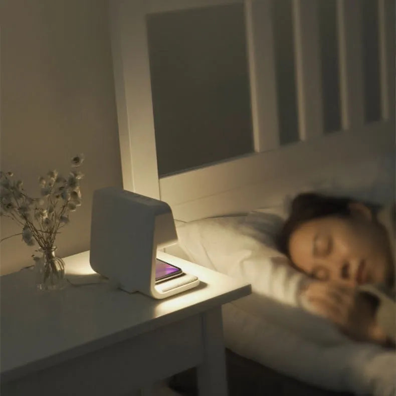 White 3-in-1 bedside lamp with wireless charging pad, LCD display, and ABS lampshade