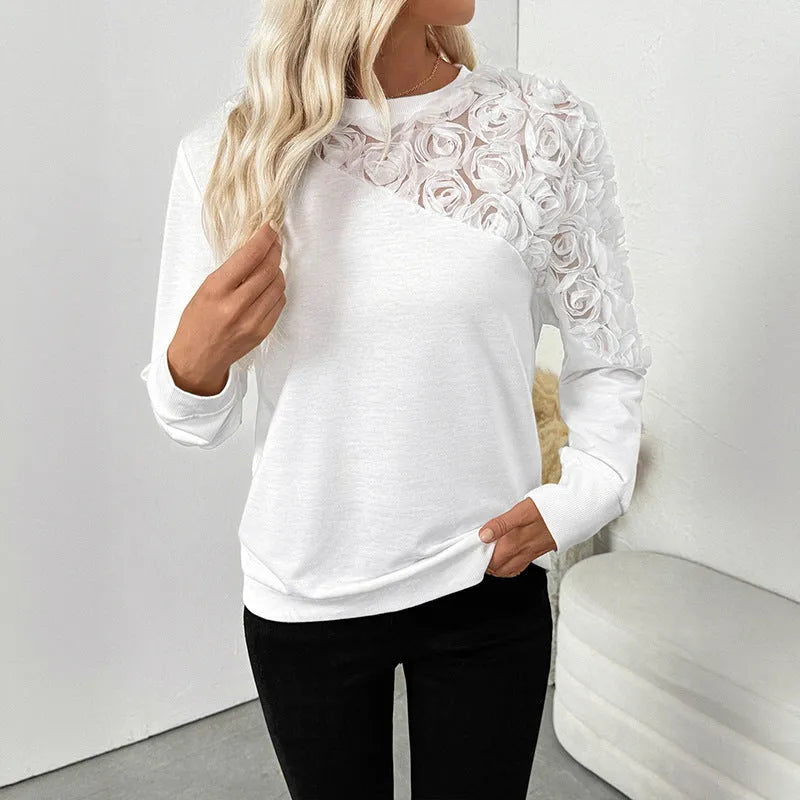 White long sleeve top with floral pattern, loose pullover style