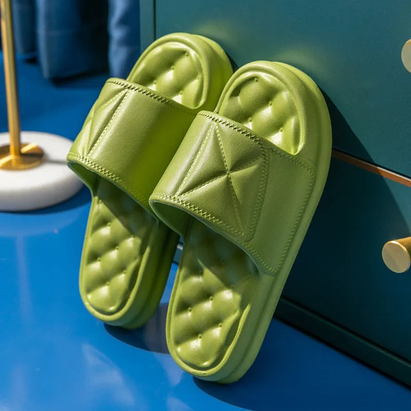 A pair of thick-soled EVA bathroom slippers in a choice of colours, showing non-slip sole texture.