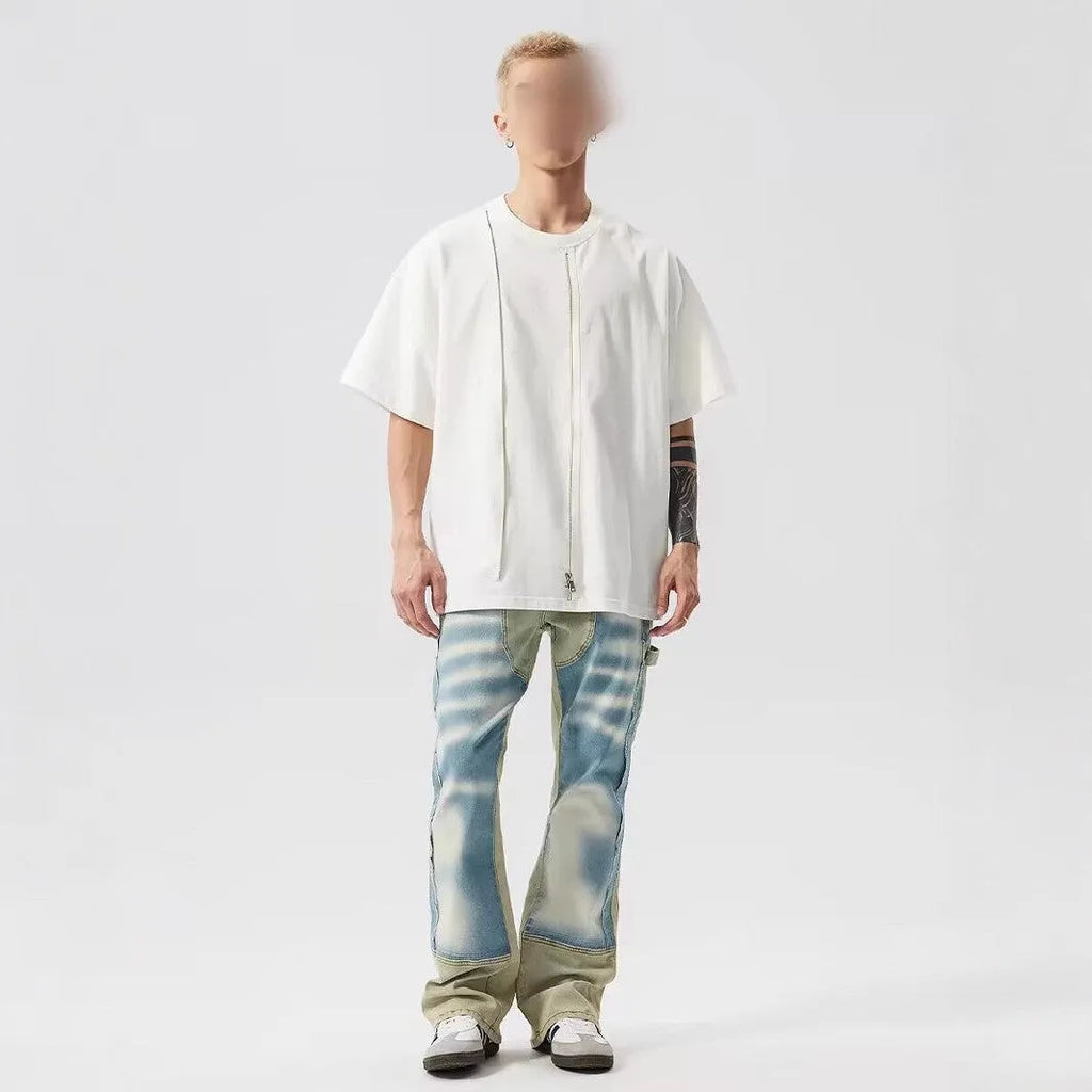 Retro yellow and blue patchwork jeans with splash-ink and damaged design details.