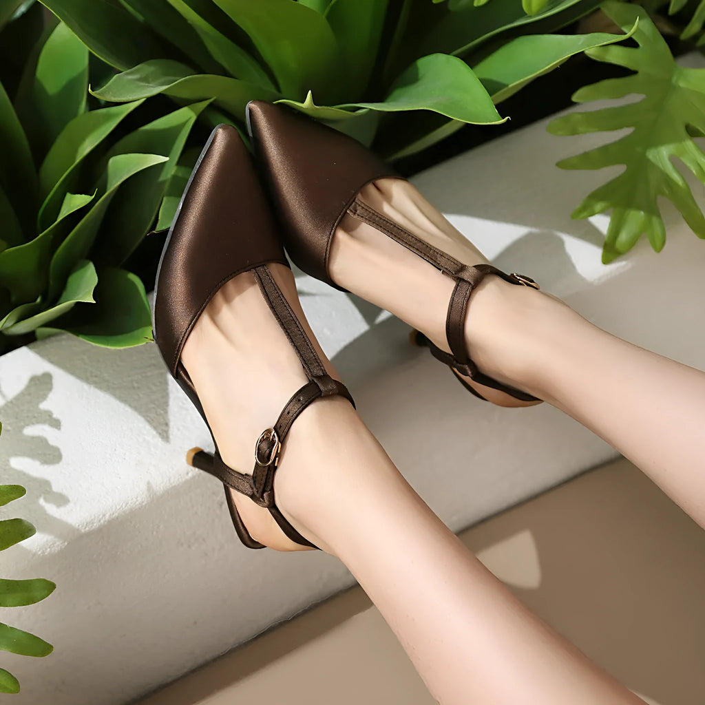 Women's pointed toe T-strap high heels in black top grain leather with unlined inner