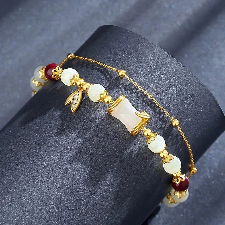 Bamboo-themed bracelet with ruyi motif and coloured flower glass beads on an electroplated chain.