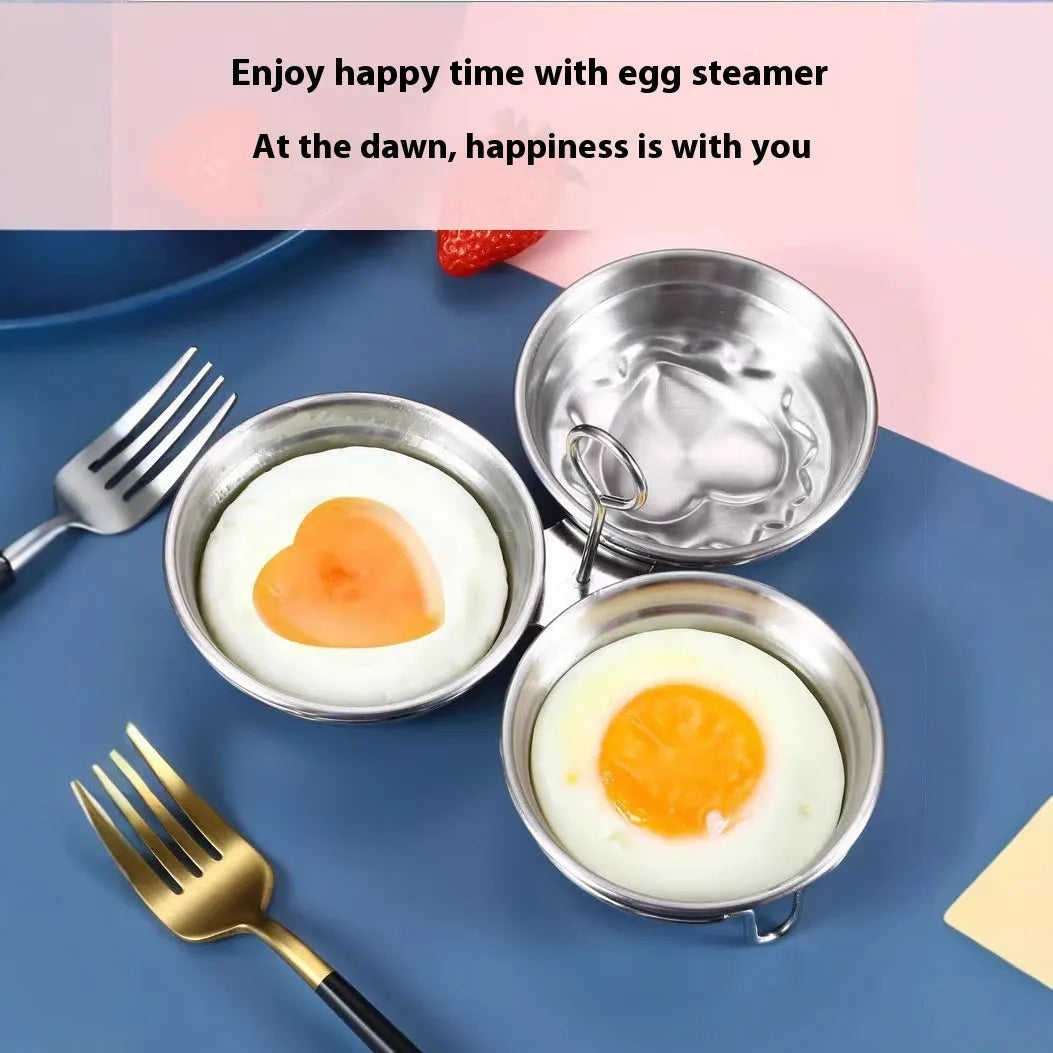 Small stainless steel egg steamer in both round and love-shaped designs on a kitchen counter.