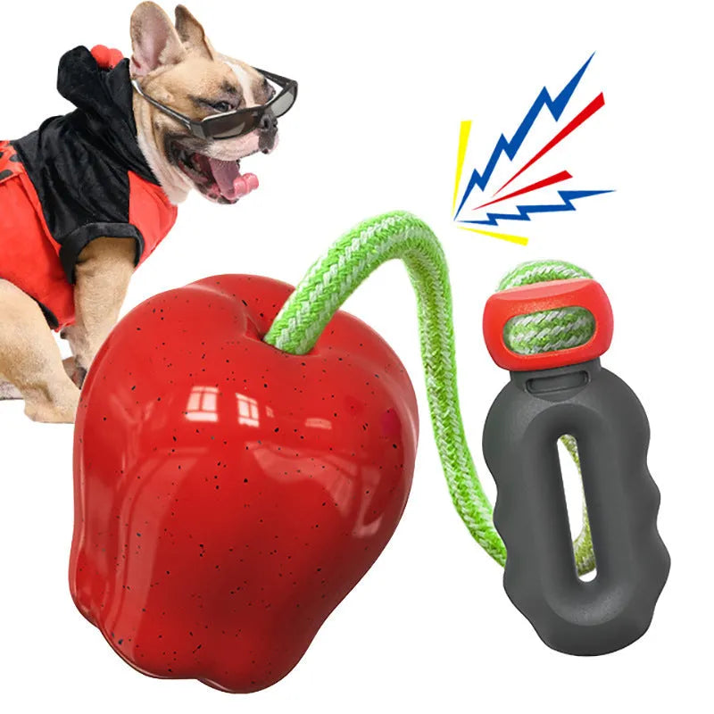 Green plastic dog molar chew toy with dropping ball food dispenser mechanism