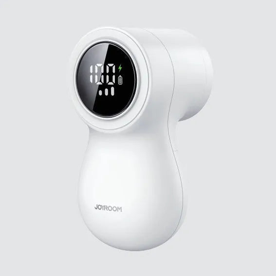 White electric lint remover with LED display, USB port, and stainless steel cutter head on a fabric background.