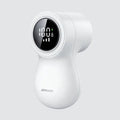 White electric lint remover with LED display, USB port, and stainless steel cutter head on a fabric background.