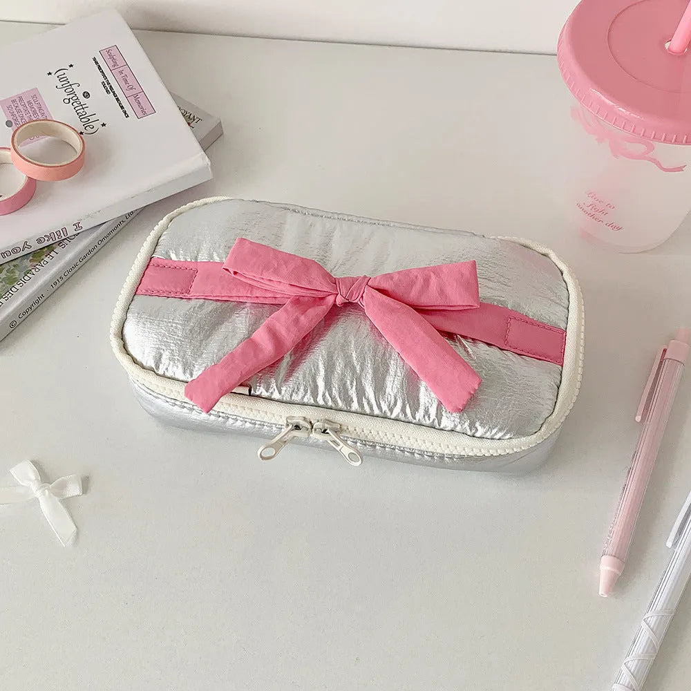 Soft polyester cotton pencil case with minimalist bow design, available in six colours including pink, black and yellow