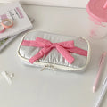 Soft polyester cotton pencil case with minimalist bow design, available in six colours including pink, black and yellow