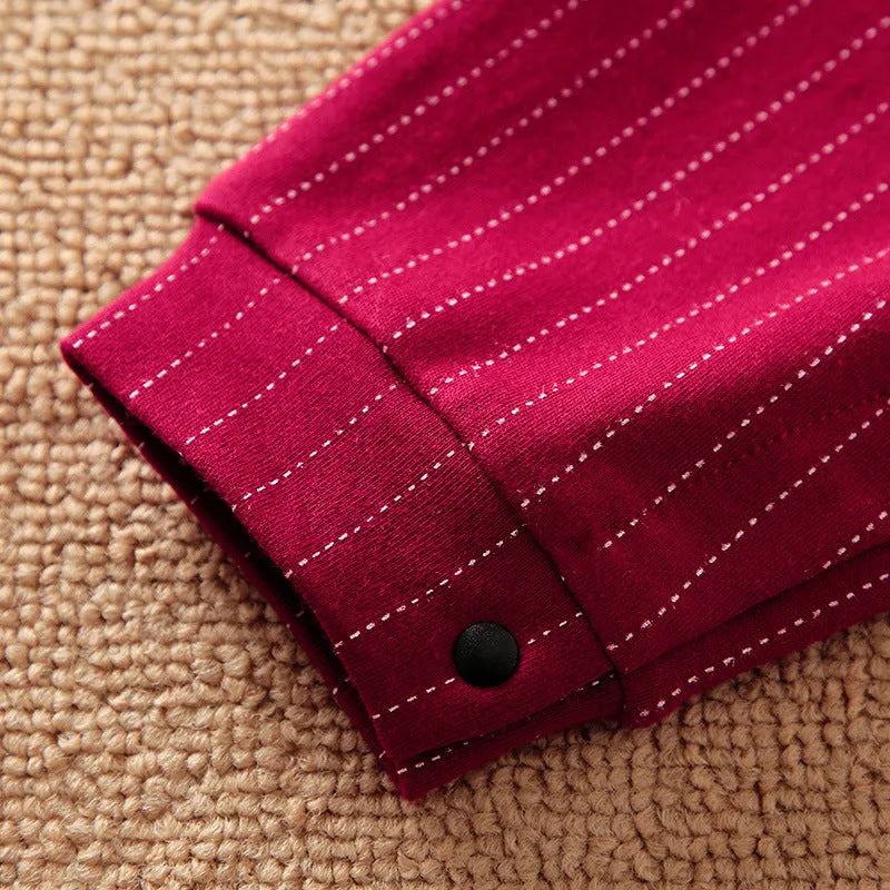Wine red cotton baby boy romper suit with long sleeves and single-breasted closure.