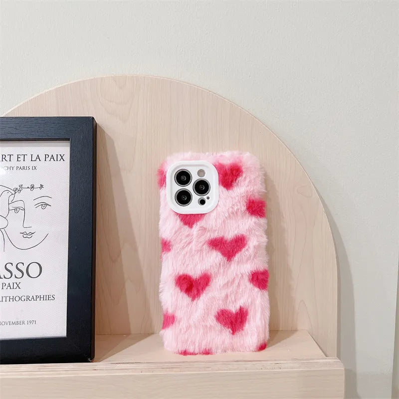 Pink silicone iPhone case with a cartoon design on the back.