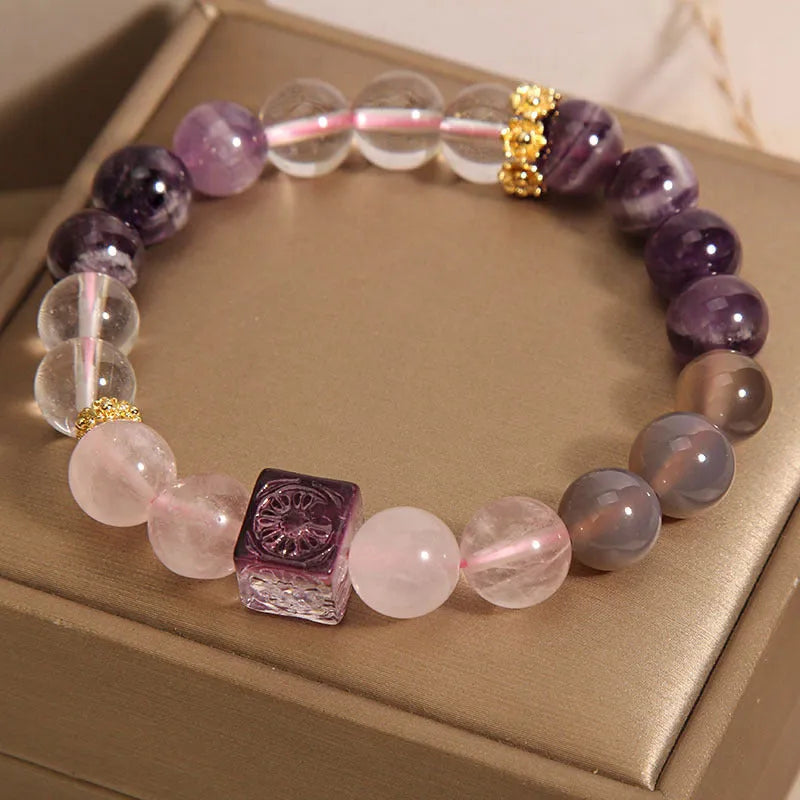 Purple women's amethyst crystal bracelet with rhinestone details showing 10mm size