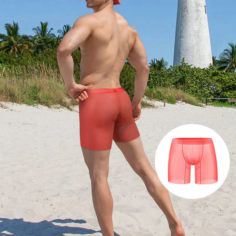 Men's solid colour ice silk boxer shorts with a low-rise waist, shown in orange.