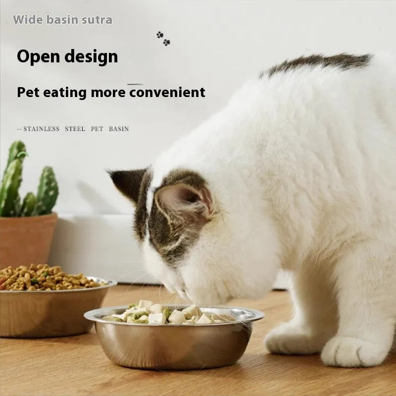 Stainless steel pet food bowl with non-slip base on a kitchen floor