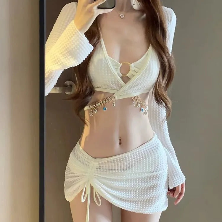 Women's black long sleeve bikini swimsuit with split hot spring design on white background