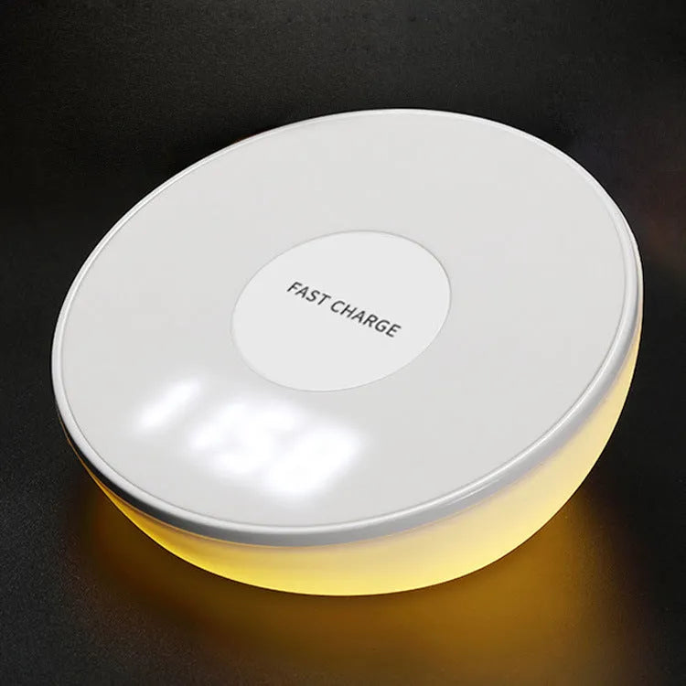White wireless charger with clock display and three control buttons for mobile phone charging