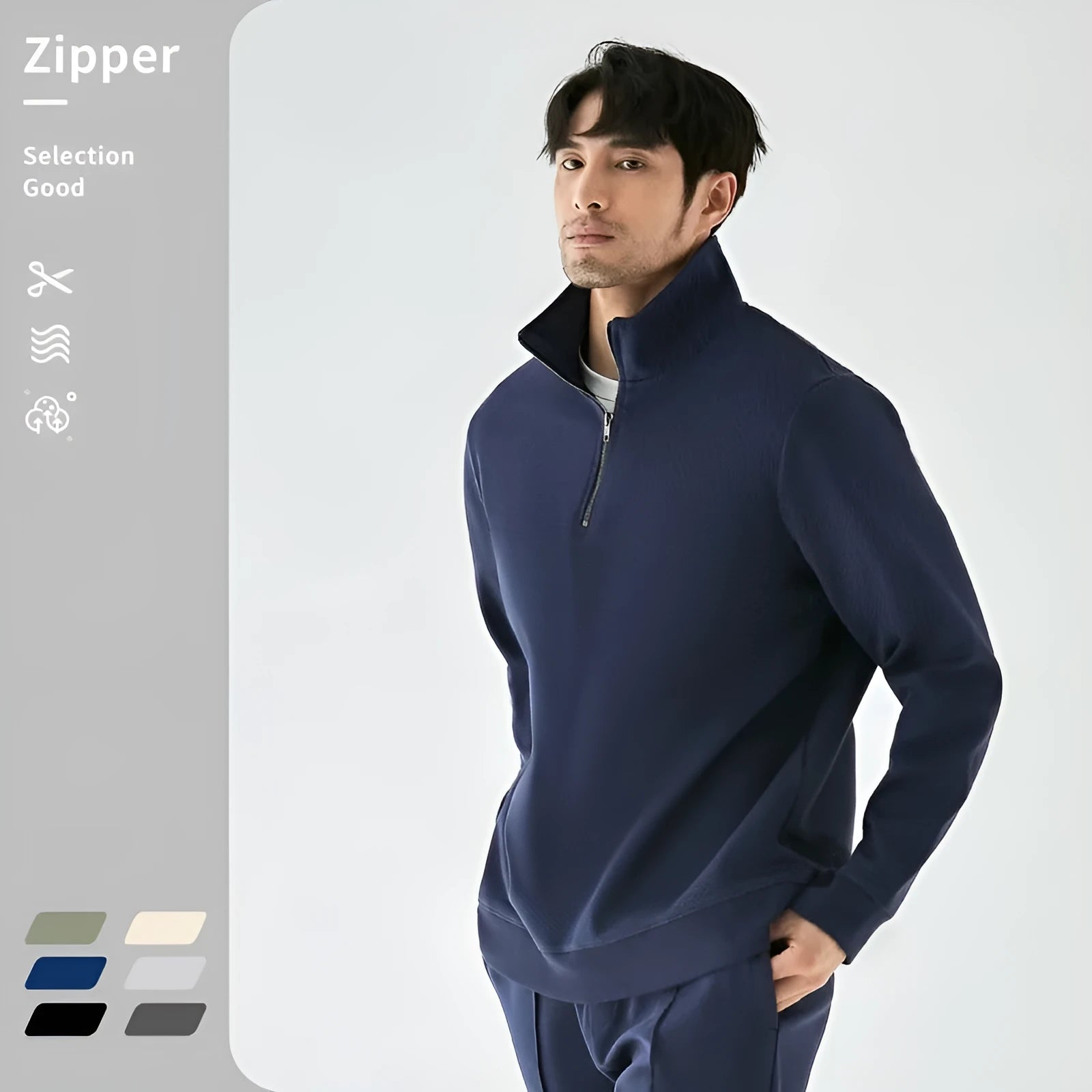 Man wearing a grey zip-front stand collar cotton sports sweater with a straight cut for casual wear.