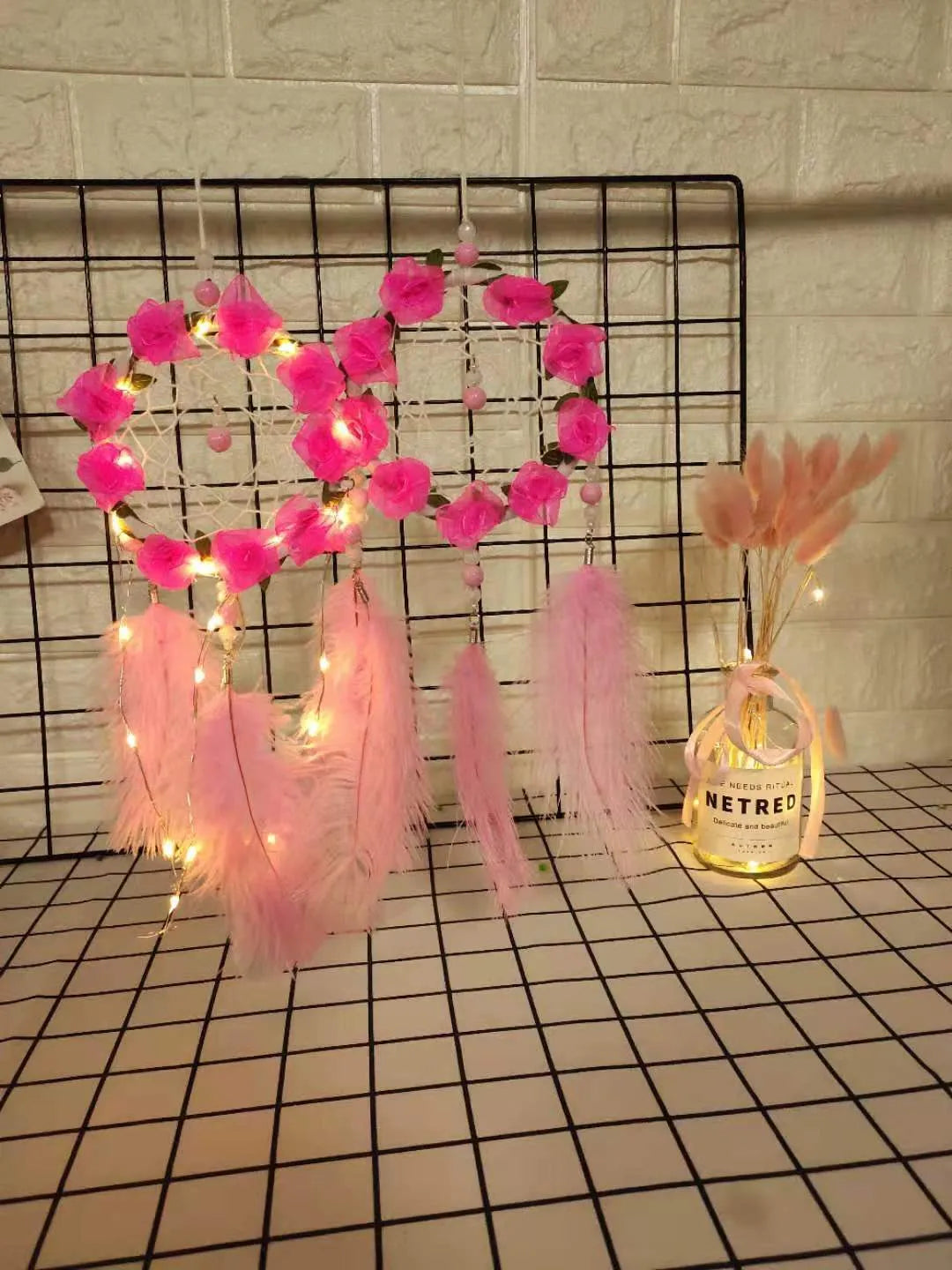 Pink ostrich feather dreamcatcher wind chime measuring 10cm for wall decoration