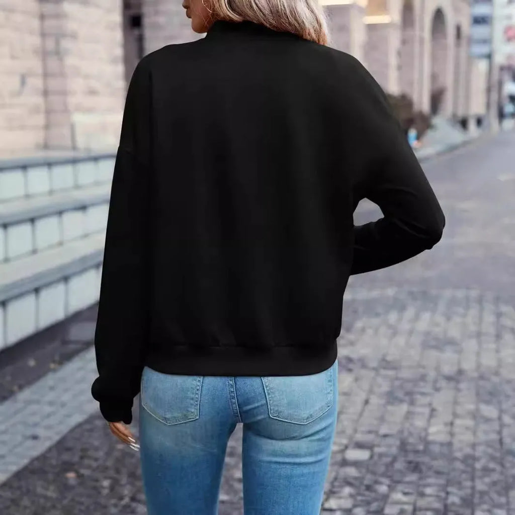 A black women's long sleeve zip-up casual jacket with faux pockets.