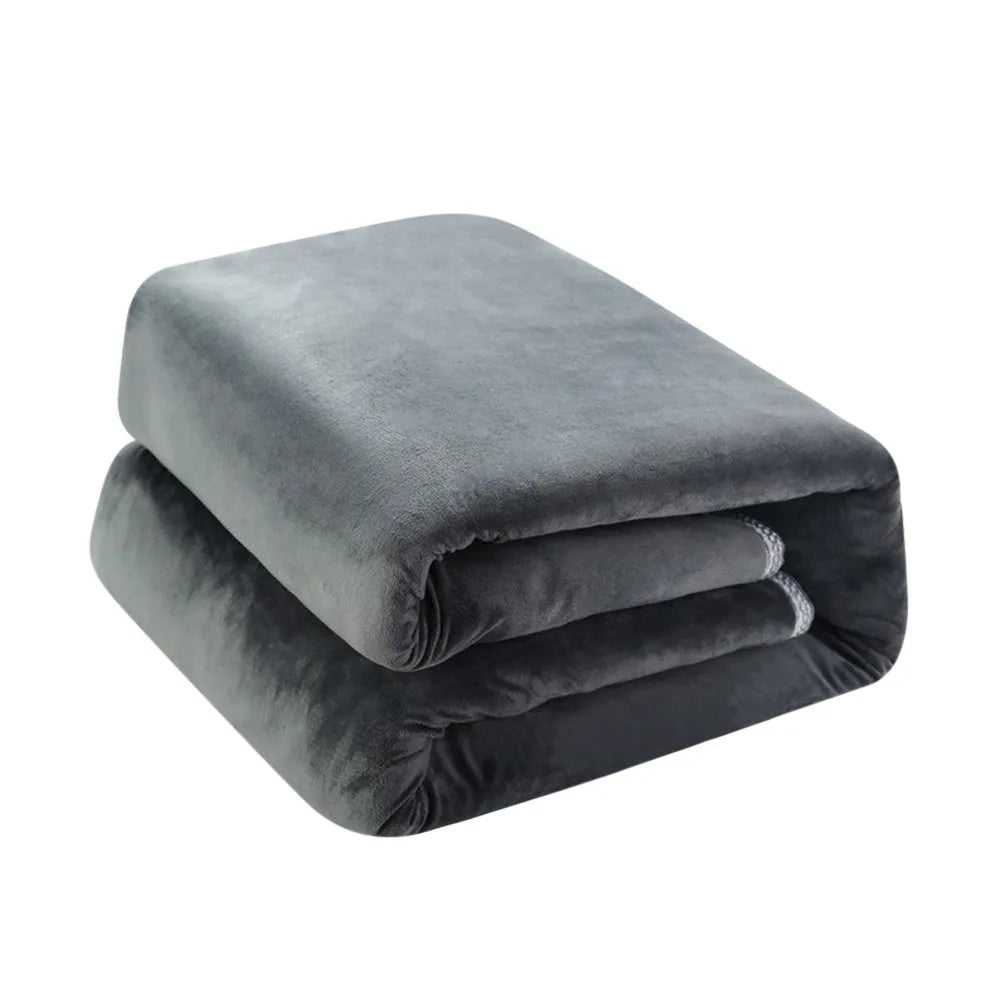 Tweed electric heating blanket in solid grey colour on a bed