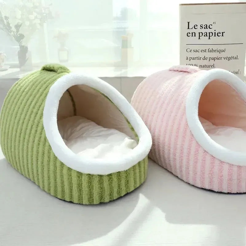 Striped thickened 3D dog bed with removable sponge mattress in blue, shown in a home setting