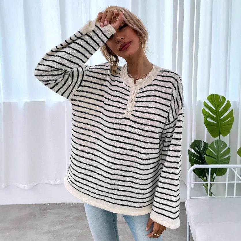 Black striped women's casual top with drop shoulders and button detailing