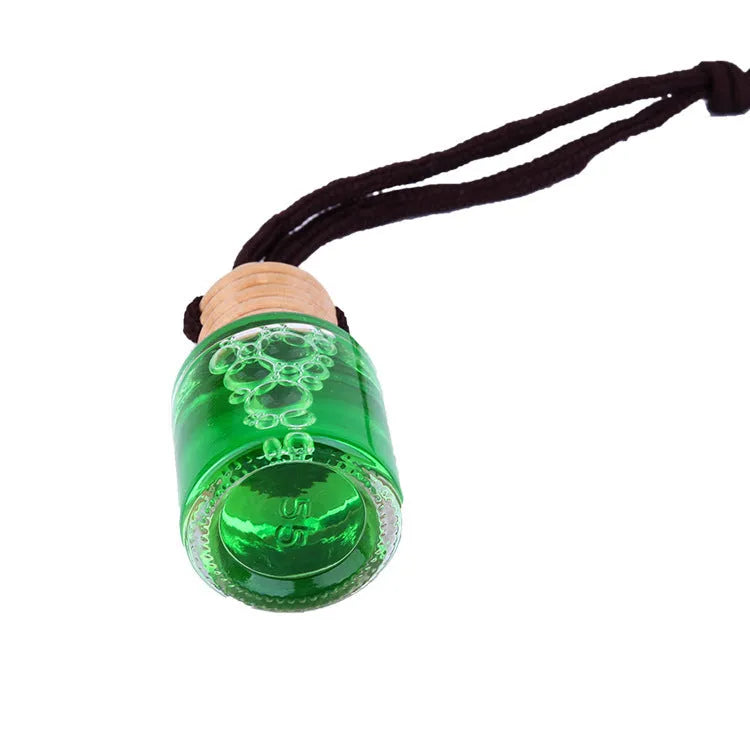 Glass bottle car air freshener hanging ornament showing six fragrance options: lavender, lemon, apple, strawberry, ocean, and floral