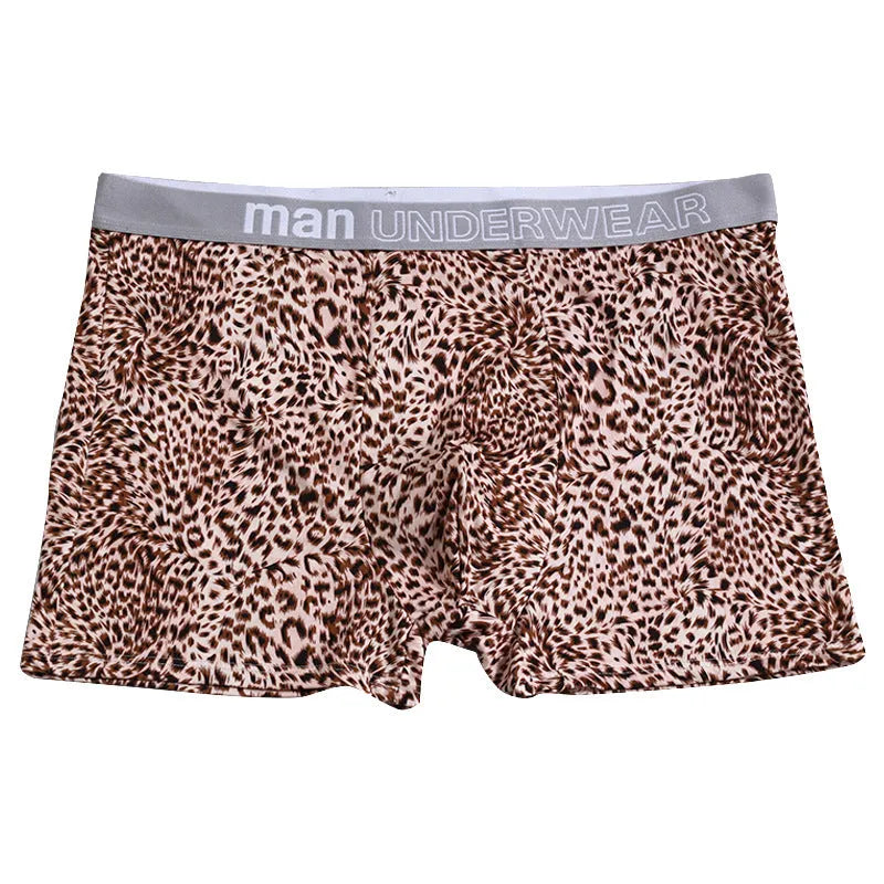 Men's loose fit leopard print boxer shorts showing mid-waist design and polyester knit fabric texture