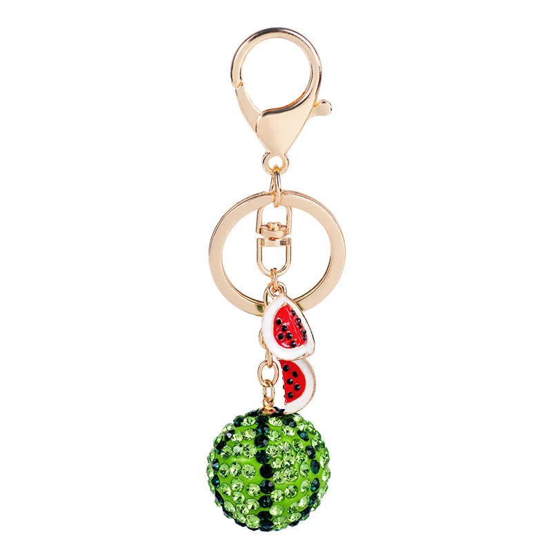 Green zinc alloy watermelon-shaped keychain measuring 12 cm.