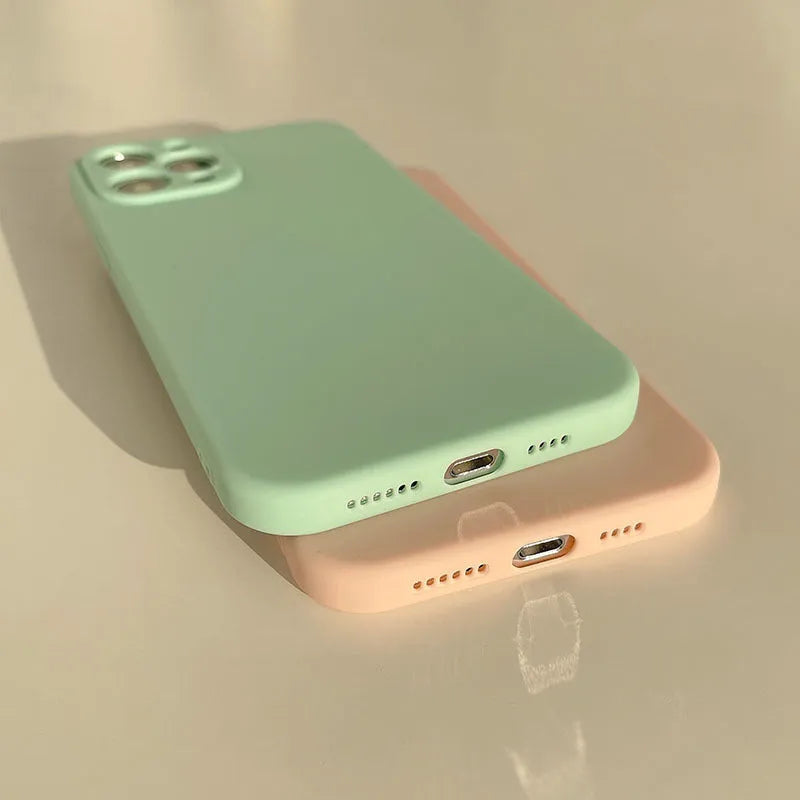 Frosted matte TPU phone back cover case for iPhone 14 in slate blue colour on a table.