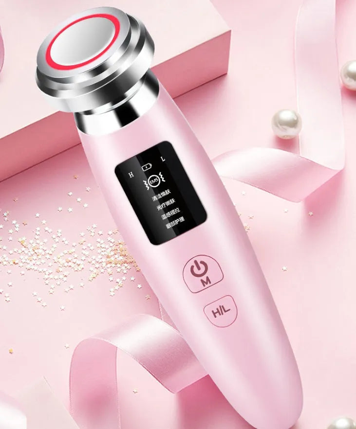 Pink cleansing and rejuvenating beauty instrument measuring 185mm long