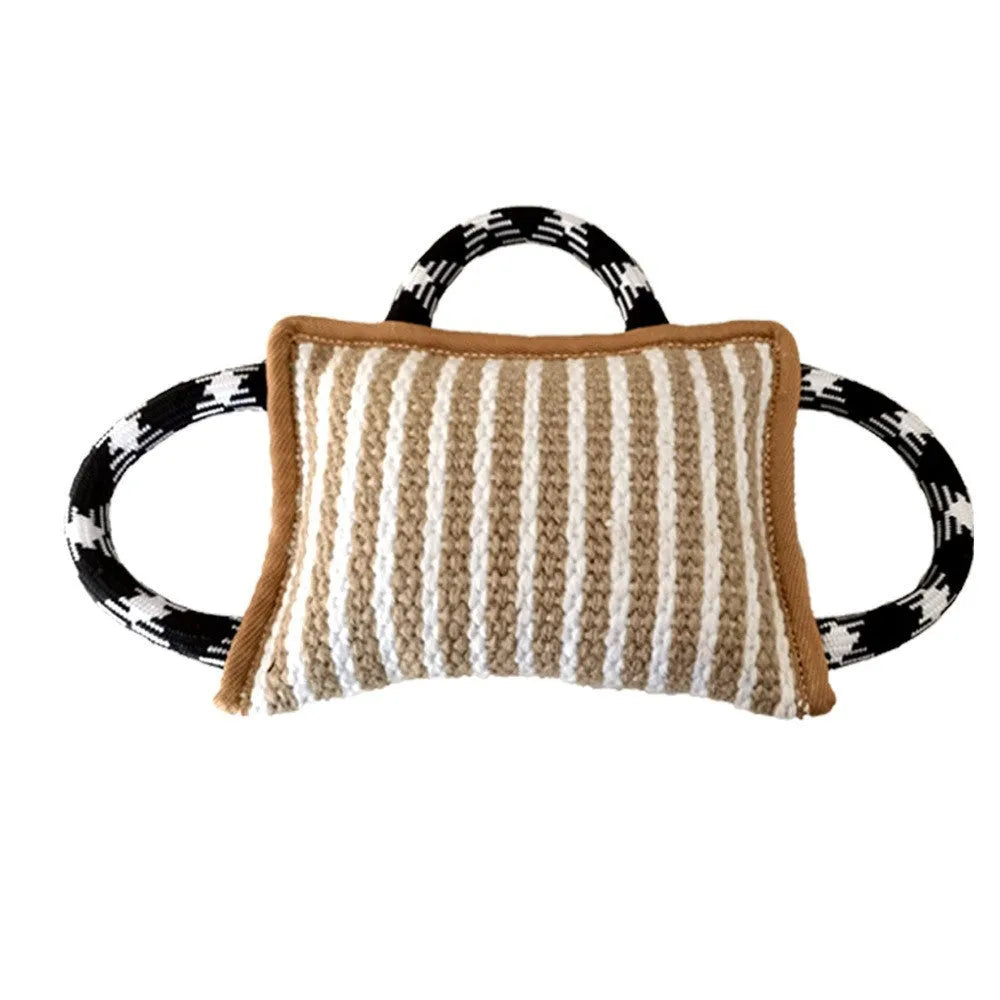 Colourful dog tug toy with a jute bite pillow centre and three rope handles.