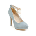 Women's blue platform high heels with a pointed toe and stiletto heel on a white background.