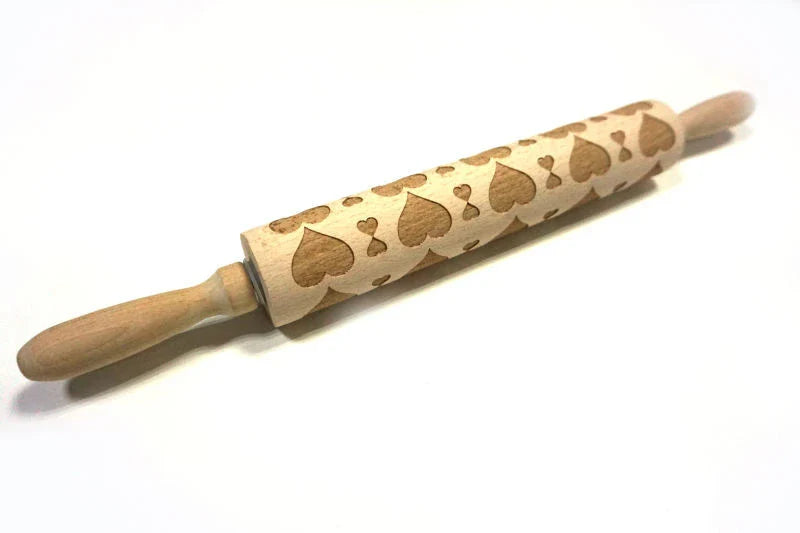 Personalized Christmas rolling pin with a variety of embossed holiday designs, including snowflakes, reindeer, and Merry Christmas patterns