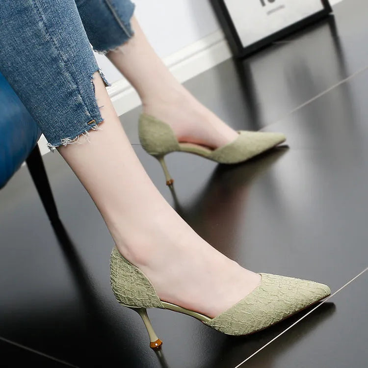 Women's black pointed toe stiletto high heels with a PU upper on a white background.