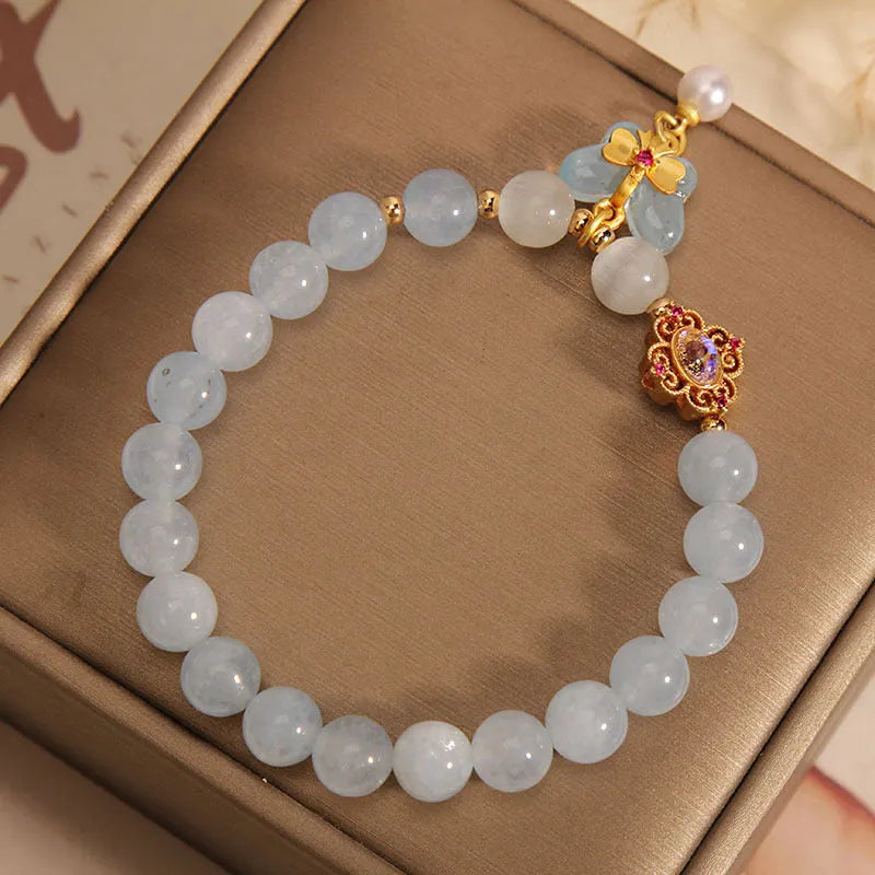 Crystal bracelet with aquamarine butterfly pendant and rhinestone details for women