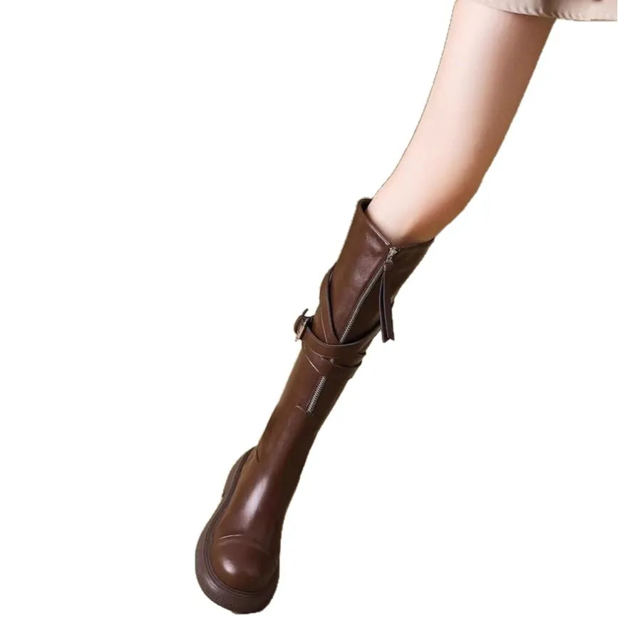 Brown women's riding boots with thin high tube, front zipper, round toe, and chunky heel