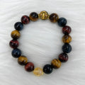 Natural golden-brown tiger eye gemstone bead bracelet with an adjustable clasp on a wrist.