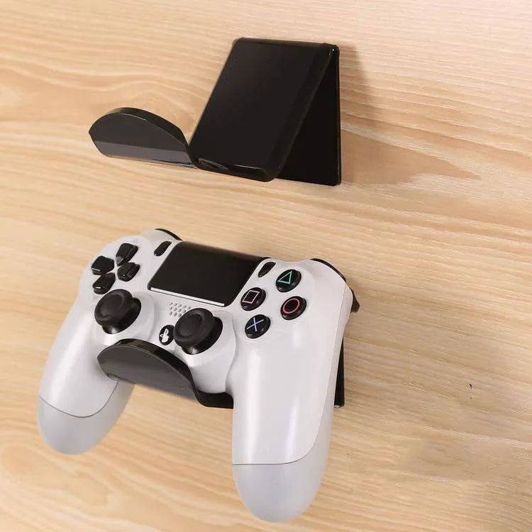 Universal gaming controller wall mounting bracket shown in black, white and transparent colour options