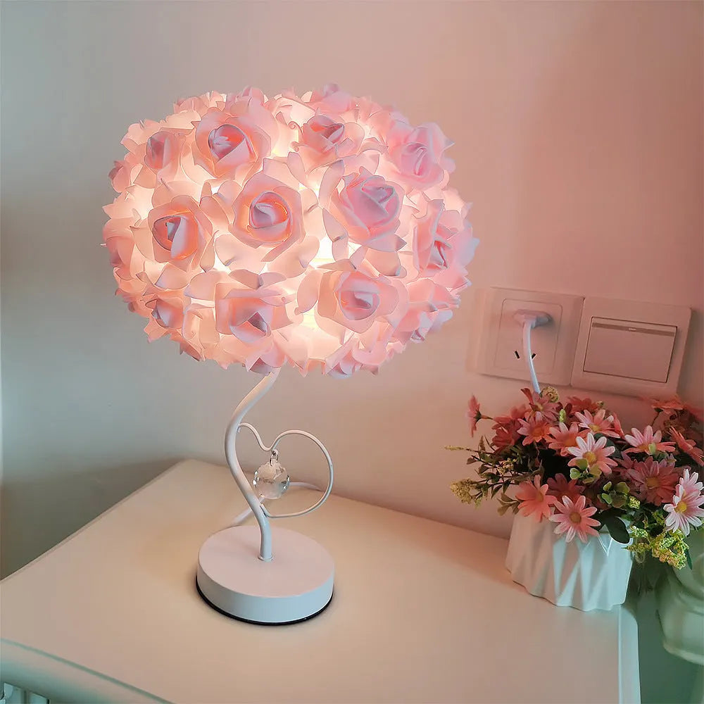 Heart-shaped crystal table lamp with metal holder, apricot colour, on bedside table