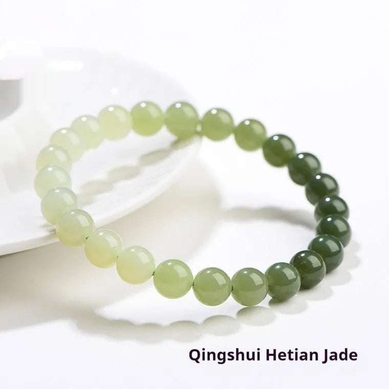 Natural clear water Hetian jade ball bracelet with round and barrel bead options.