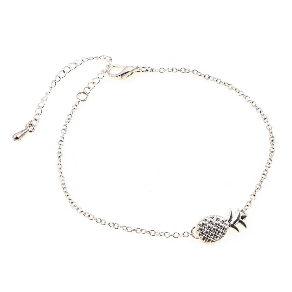 Close-up of a women's alloy bracelet featuring a detailed pineapple charm in a gold or silver tone.