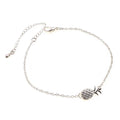 Close-up of a women's alloy bracelet featuring a detailed pineapple charm in a gold or silver tone.